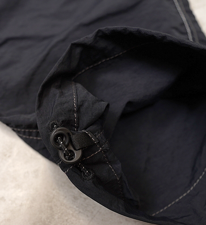 【and wander】アンドワンダー women's NY taffeta hiker 2way pants "Black"